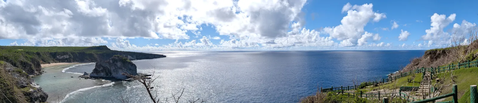 Panorama from Bird Island Lookout across the bay, the islet, and the open Pacific