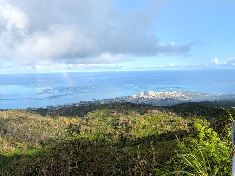 A rainbow over the reef and Garapan, seen from the summit of Mount Tapochau