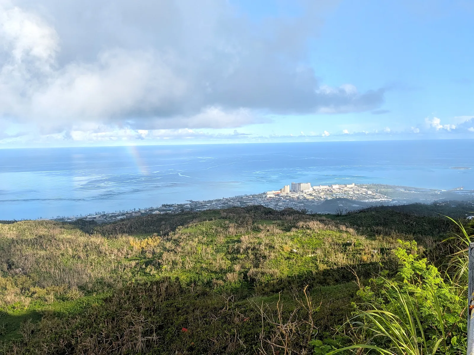 A rainbow over the reef and Garapan, seen from the summit of Mount Tapochau