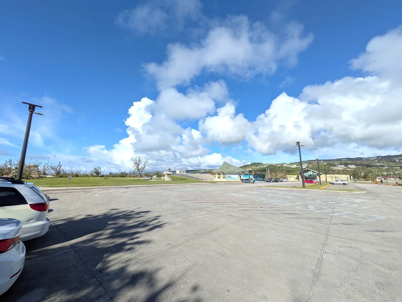 The large, mostly empty paved parking lot at American Memorial Park, Garapan