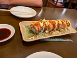 Seared salmon sushi roll topped with tobiko and spicy mayo at Himawari Restaurant, Garapan